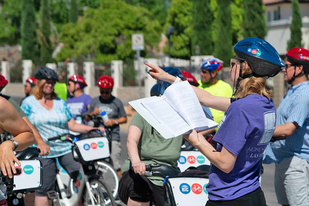 Tour guide leading a historic bike tour